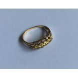 A diamond and yellow stone three row ring. Approx.