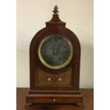 An Edwardian inlaid mahogany dome top mantle clock