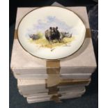 Eight large boxed commemorative plates. Est. £20 -