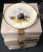 Eight large boxed commemorative plates. Est. £20 -