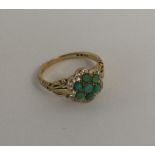 An attractive turquoise and diamond cluster in 18