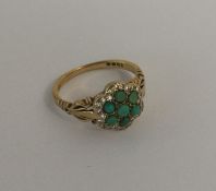 An attractive turquoise and diamond cluster in 18