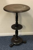 A circular mahogany table on shaped base. Est. £20