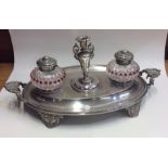 An attractive Victorian oval silver plated inkstan