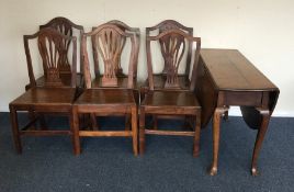 A set of four oak dining chairs together with a ma