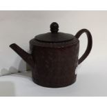 An early terracotta Chinese teapot with textured b