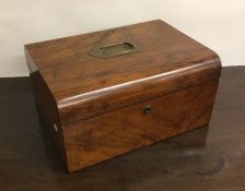 A walnut dome top box with copper handle. Est. £15
