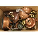 A box containing old copper oil lamps, vases etc.