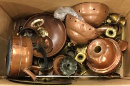 A box containing old copper oil lamps, vases etc.