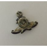 A gold mounted and enamelled Military brooch inset