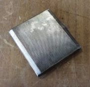 An engine turned silver cigarette case. Approx. 11
