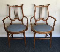 A pair of unusual chairs in the form of harps with