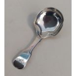 A Victorian silver fiddle pattern caddy spoon. Bir