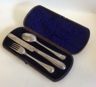 A cased three piece silver christening set with be
