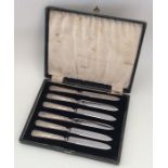 A boxed set of six silver handled tea knives. Appr