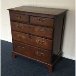 An Antique oak chest of three long and two short d