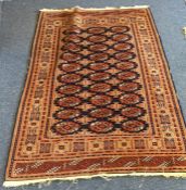 A small Oriental rug. Est. £25 - £35.