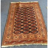 A small Oriental rug. Est. £25 - £35.