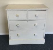 A painted pine chest of four drawers. Est. £30 - £