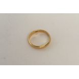 A 22 carat gold plain wedding band. Approx. 3.7 gr