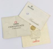 Old Rolex and Omega paperwork. Est. £30 - £50.