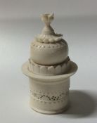 An unusual carved ivory box in the form of a templ