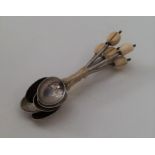 A set of six silver bean top coffee spoons. Approx