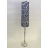 STUART DEVLIN: A tall silver candlestick with gild