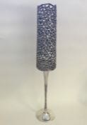 STUART DEVLIN: A tall silver candlestick with gild