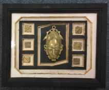 A framed and glazed set of mounted Benin Bronze pl