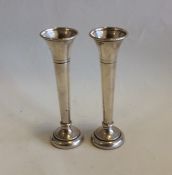 A pair of modern silver spill vases with beaded ri