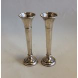 A pair of modern silver spill vases with beaded ri