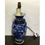 A blue and white Chinese vase converted to a lamp.