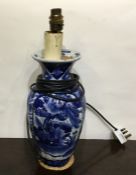 A blue and white Chinese vase converted to a lamp.