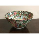 A Canton tea bowl decorated in bright colours. App