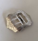 A Russian silver buckle with floral decoration. Ap