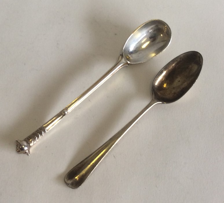 A Georgian silver gilt teaspoon. London. Together