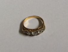 A good diamond half hoop five stone ring in 18 car