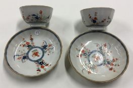 A pair of Chinese tea bowls and covers with shaped