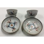 A pair of Chinese tea bowls and covers with shaped