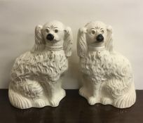 A pair of Staffordshire dogs. Est. £10 - £20.