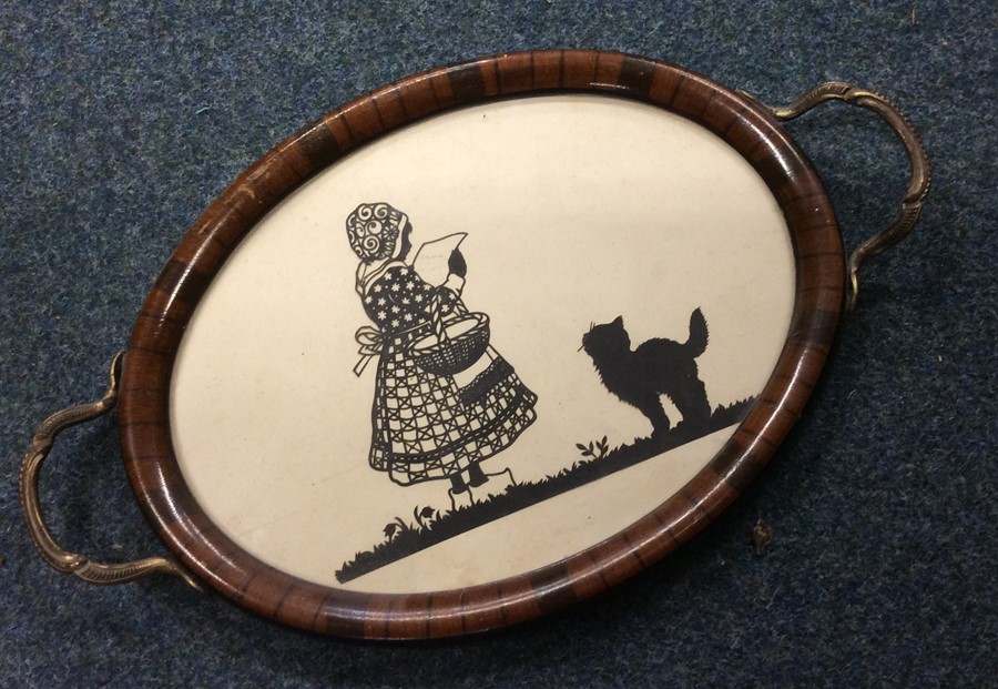 An attractive oval tray decorated with a silhouett