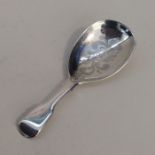 A Georgian silver fiddle pattern caddy spoon engra