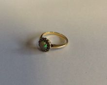 A Victorian opal and diamond circular cluster ring
