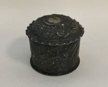 An embossed silver box with crimped rim. Chester.