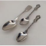 A pair of unusual large silver teaspoons together