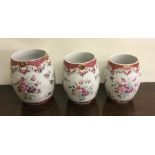 A good set of three tapering Famille Rose tankards