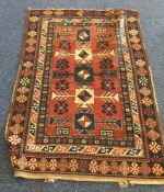 A small Oriental rug. Est. £25 - £35.