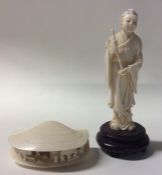 A carved ivory figure of a clam decorated with fig