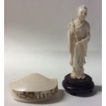 A carved ivory figure of a clam decorated with fig